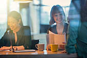 Businesswomen talking in office meeting