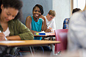 Student sitting with hand on chin