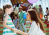 Mother and girl with balloon