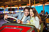 Couple on bumper car ride