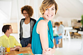 Portrait of young woman smiling at office