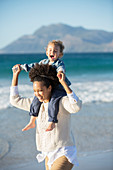 Mother and daughter playing on beach