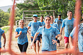 Team running in rain course