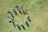 Overhead view of team connected in circle