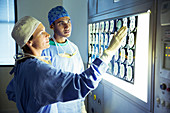 Surgeons discussing MRI scans