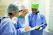 Surgeons reviewing medical record