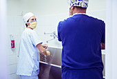 Surgeons washing hands in hospital