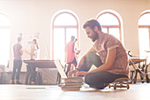 Businessman working from skateboard