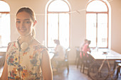 Businesswoman in sunny open office