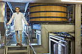 Vintner in lab coat on platform