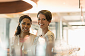 Women wine tasting in winery tasting room