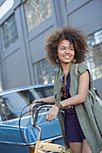 Smiling young woman with afro