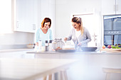 Women baking in kitchen