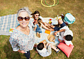 Senior woman with family at picnic
