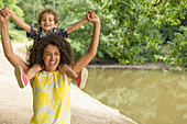 Mother carrying son on shoulders