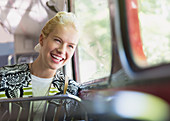 Enthusiastic woman riding bus