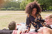 Friends hanging out relaxing on blanket