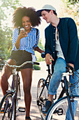 Friends on bicycles texting