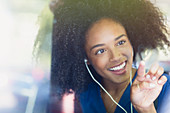 Woman with afro and headphones