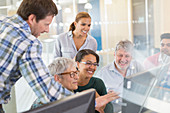 Smiling students at computer