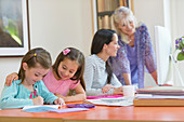 Multi-generation family doing homework