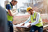 Worker reviewing blueprints