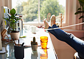 Woman with feet up on desk