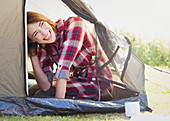 Smiling woman inside tent