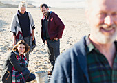 Couples clamming on sunny beach