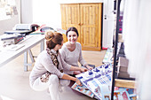 Interior designers browsing fabric