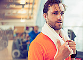 Sweating man resting in gym