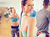 Portrait smiling woman in exercise class