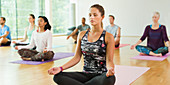 Woman in lotus position with eyes closed