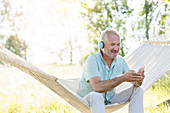 Senior man with headphones