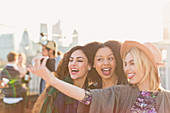Enthusiastic young women taking selfie