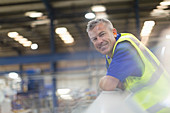 Portrait smiling supervisor in factory