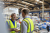 Smiling supervisor and worker handshaking