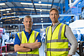 Portrait confident supervisors in factory