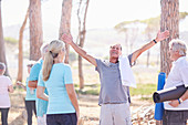 Exuberant senior man after yoga class