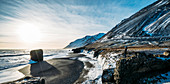 Sun shining over icy beach, Iceland