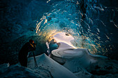Photographer in ice cave, Iceland