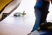 Man pulling kiteboarding equipment