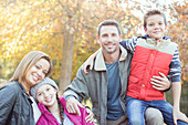 Family in front of tree