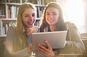 Teenage girls using tablet