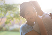 Woman hugging man outdoors