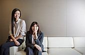 Portrait confident businesswomen on sofa