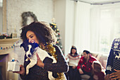 Woman holding dog and Christmas gift