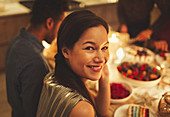 Woman at candlelight dinner party