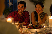 Couple at candlelight Christmas dinner