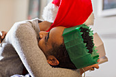 Couple in Santa hat hugging